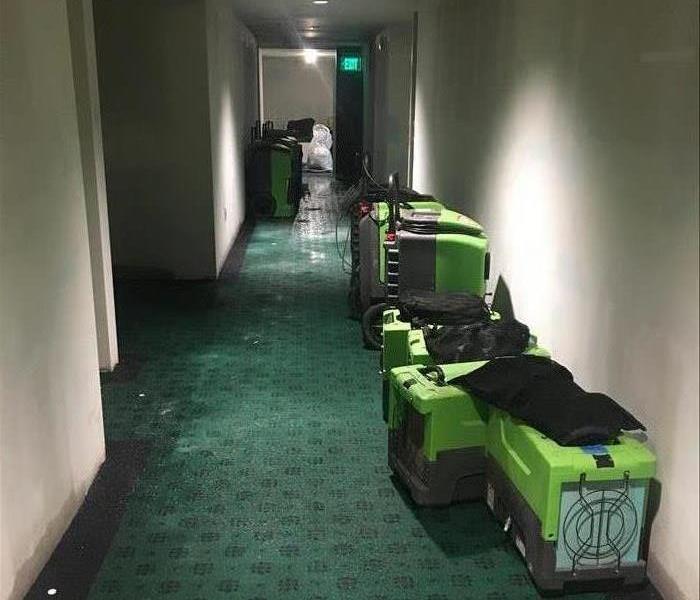 green machine in hallway with carpet. commercial water damage emergency services in old sacramento restoration near me nearby